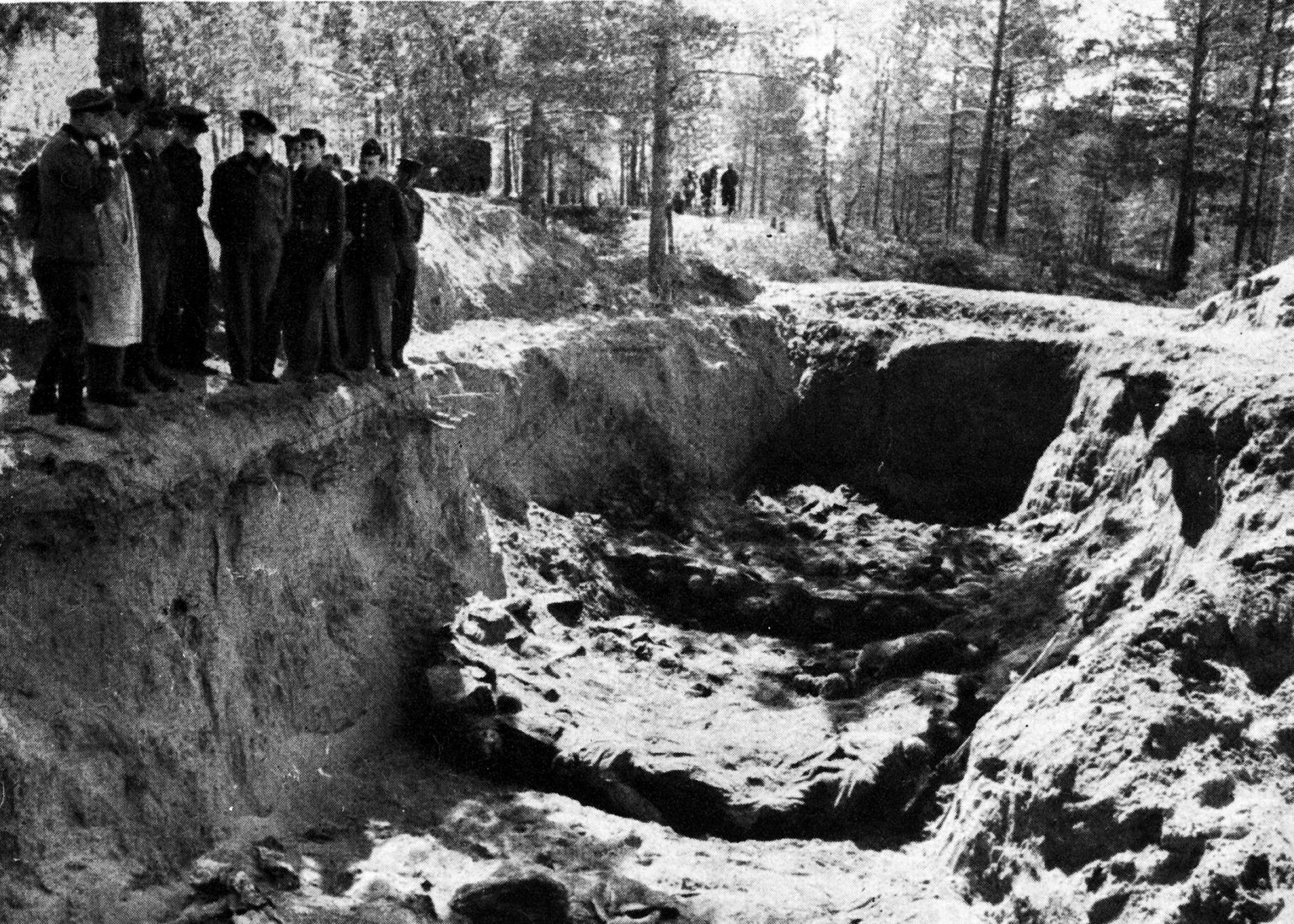 <em>The mass graves were discovered by the Germans in 1943 (Public Domain)</em>
